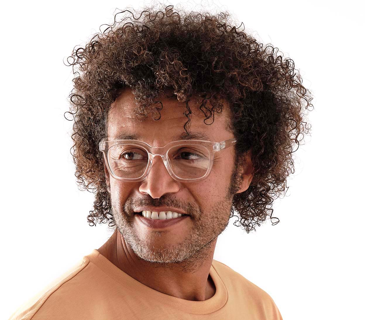 Male model wearing Toast (Clear) retro clear reading glasses with large, oversized lenses and slender temples.