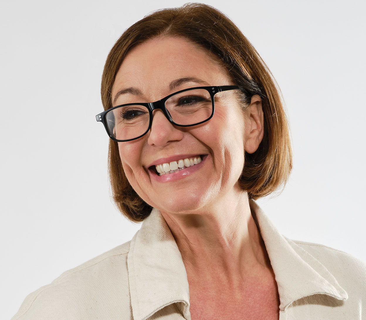 Female model wearing Eclipse (Black) classic shaped unisex reading glasses with oval lenses and a gloss black frame.