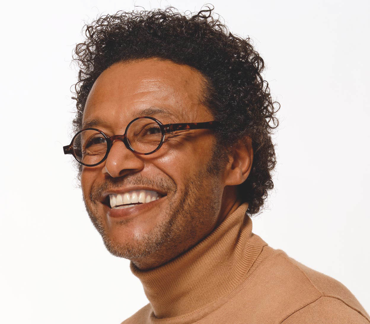 Male model wearing Woodstock (Tortoiseshell) super retro style reading glasses with round lenses in a deep tortoiseshell finish.