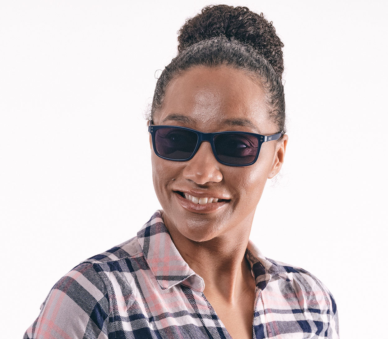 Male model wearing Jelli Sun (Multi Tortoise) unisex sun reading glasses with large square lenses and multicoloured, tortoiseshell arms and details.