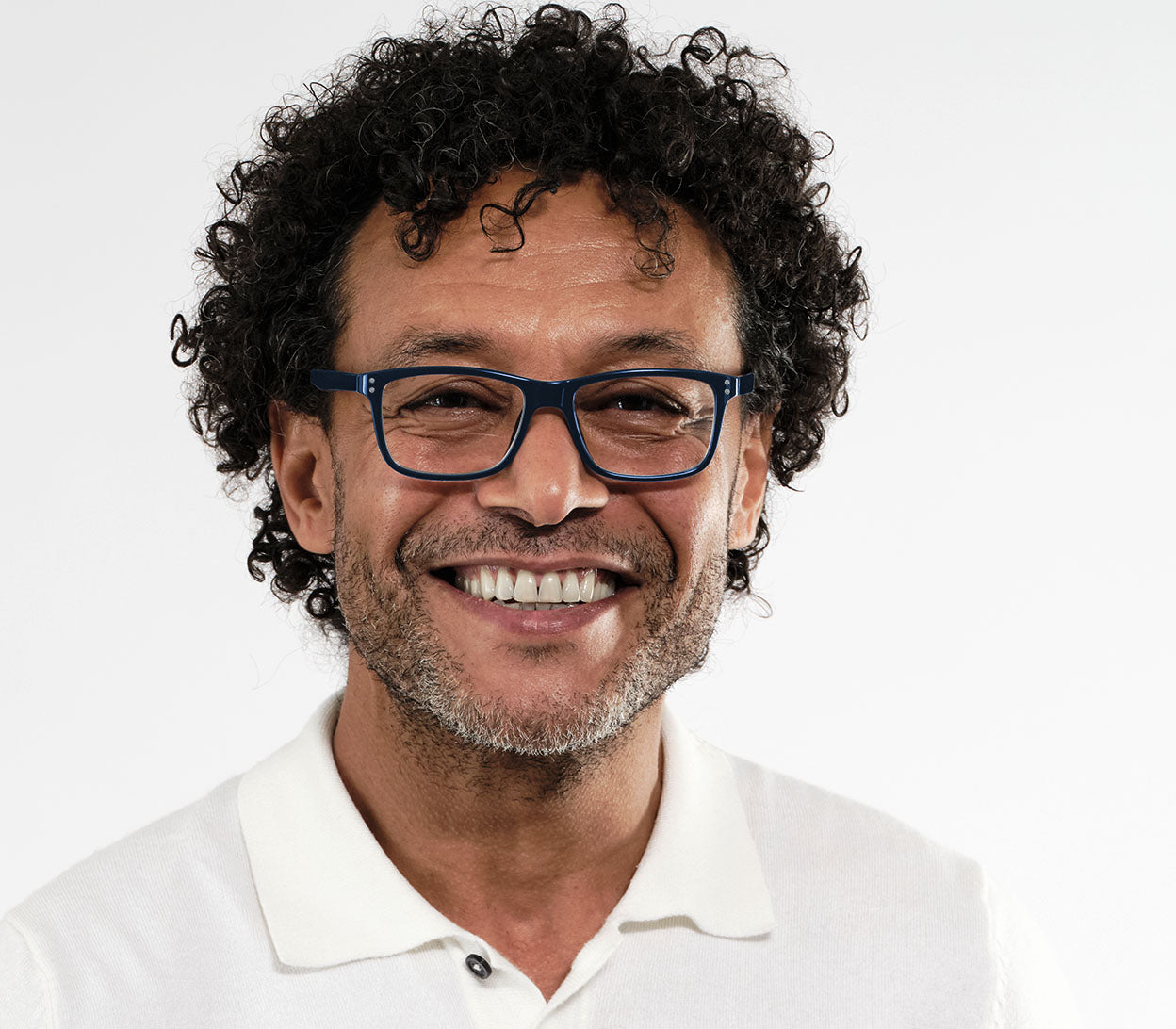 Male model wearing Dexter Bifocal (Blue) bifocal unisex reading glasses. Dark blue frames with a glossy finish.