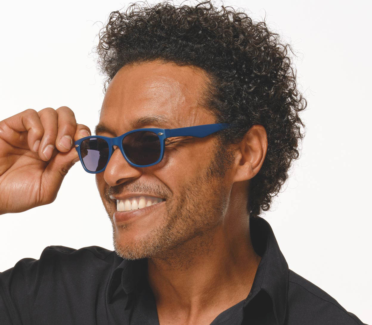 Male model wearing Cortez (Blue) retro style wayfarer sunglasses with a deep petrol blue frame and matt finish.