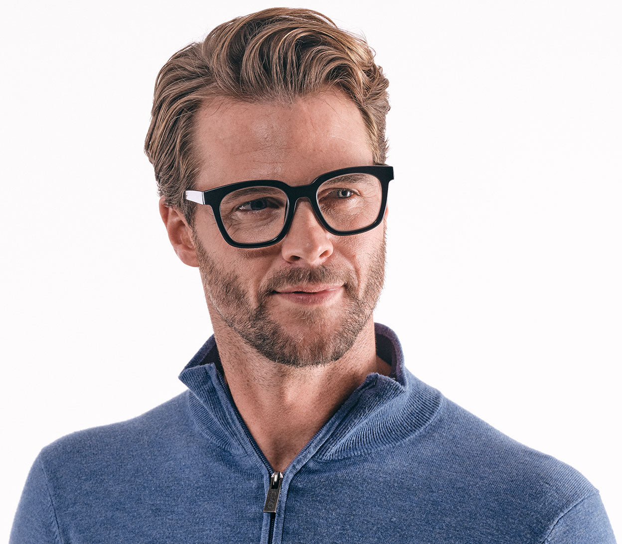 Male model wearing Toast (Black) retro black reading glasses with large, oversized lenses and slender temples.