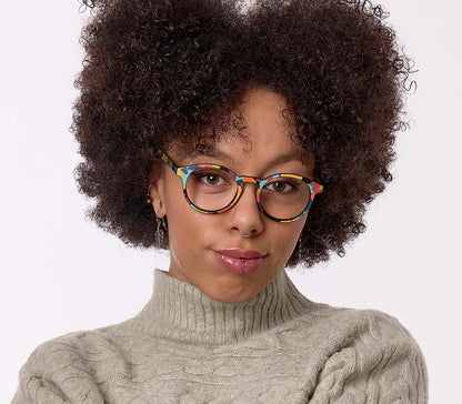 Male model wearing Fantasy (Multi-coloured) unisex, multicoloured reading glasses with a distinctive pattern and classic shaped round lenses.
