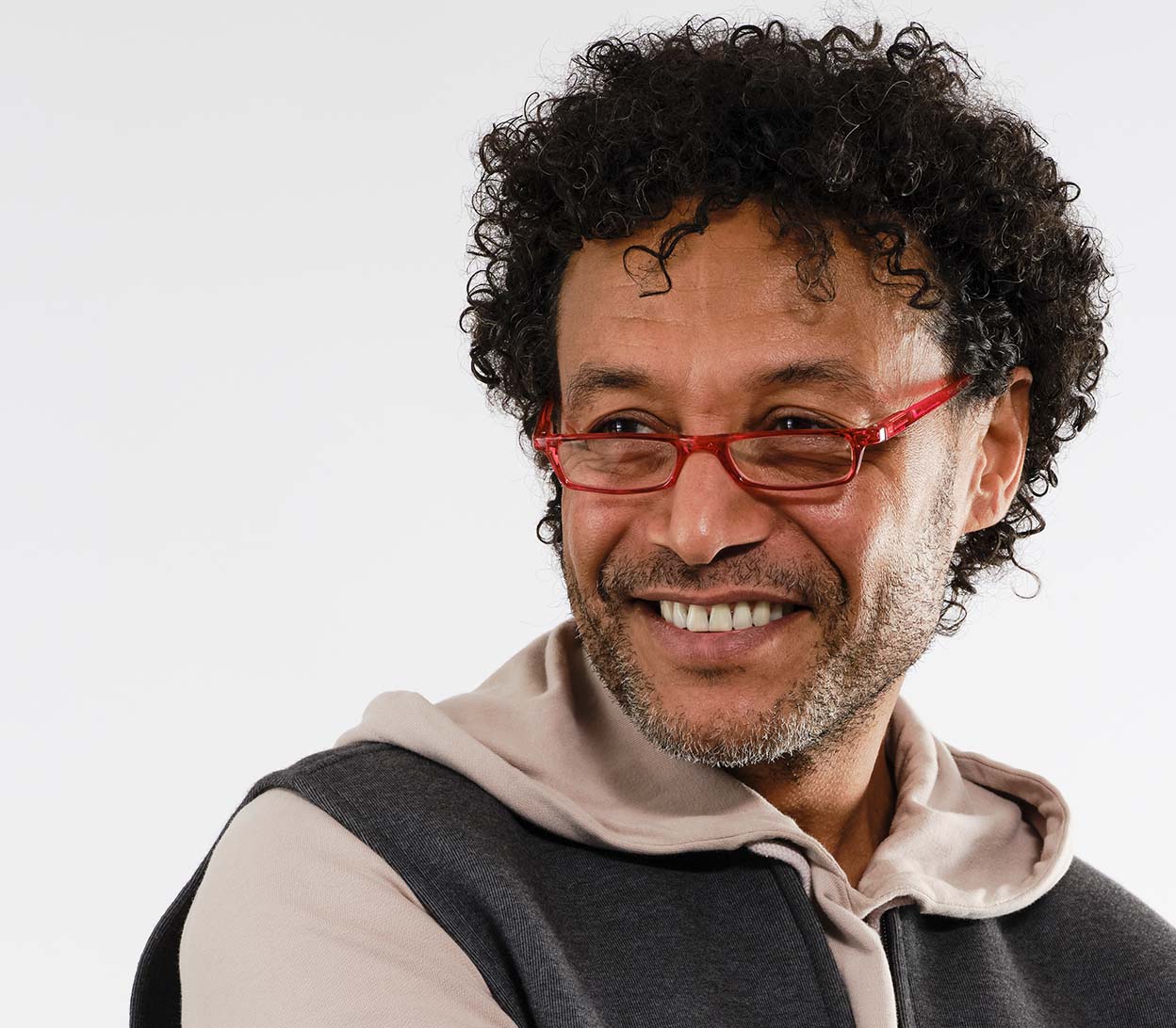 Male model wearing Mylo (Red) classic shape, slim reading glasses with red glossy frame.