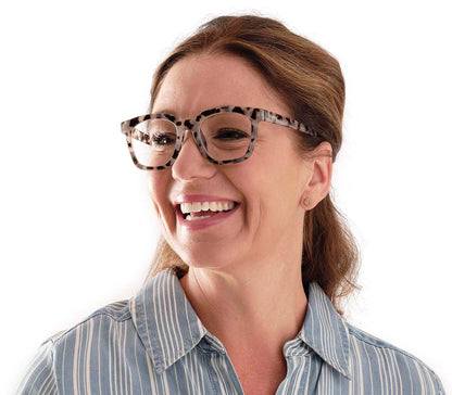 Female model wearing Toast (Grey Tortoise) retro grey tortoiseshell reading glasses with large, oversized lenses and slender temples.