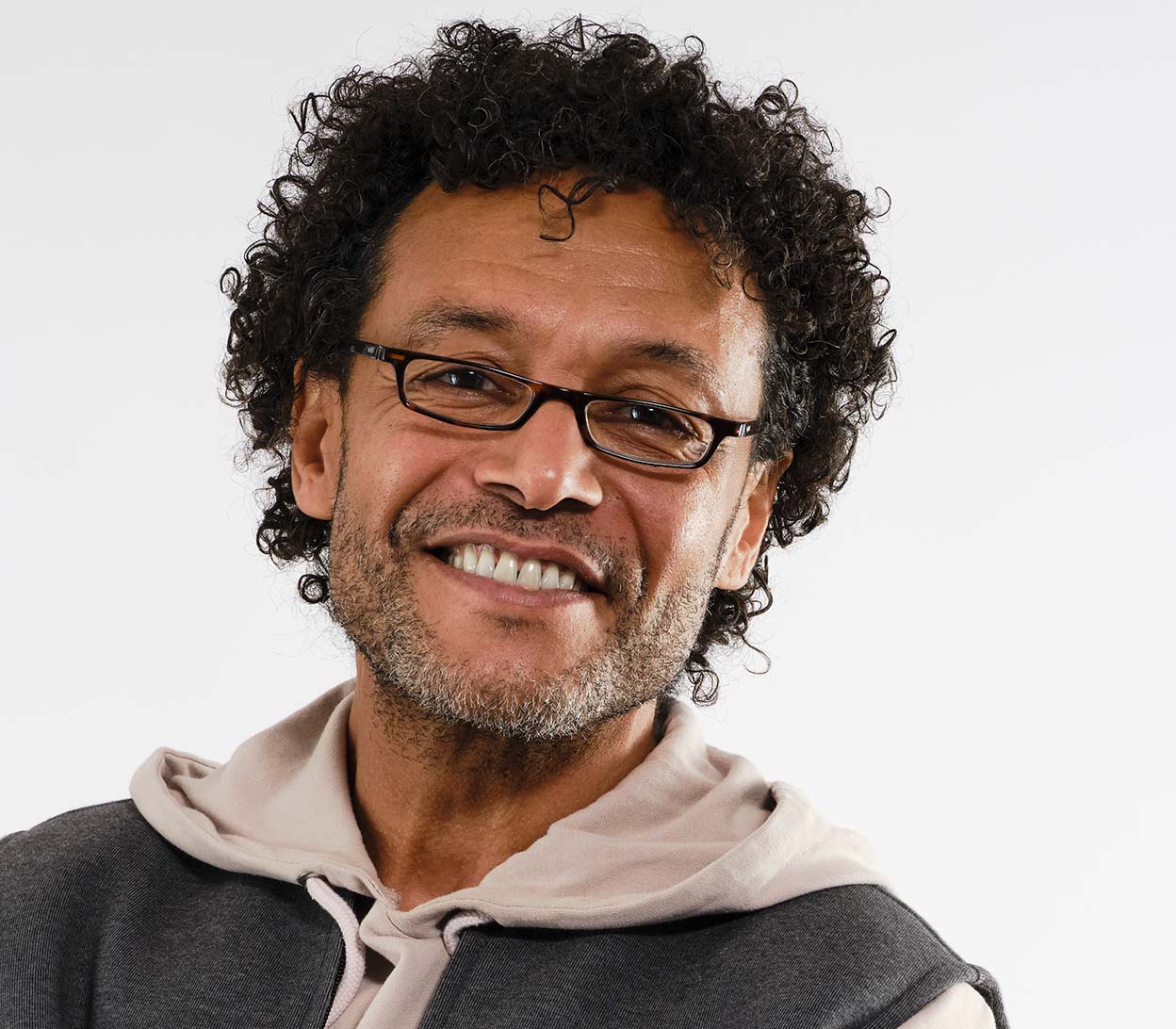 Male model wearing Mylo (Tortoiseshell) classic shape, slim reading glasses with dark tortoiseshell glossy frames.