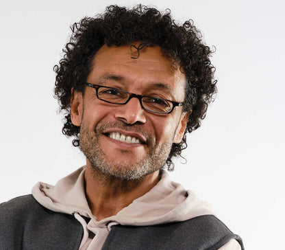 Male model wearing Mylo (Tortoiseshell) classic shape, slim reading glasses with dark tortoiseshell glossy frames.