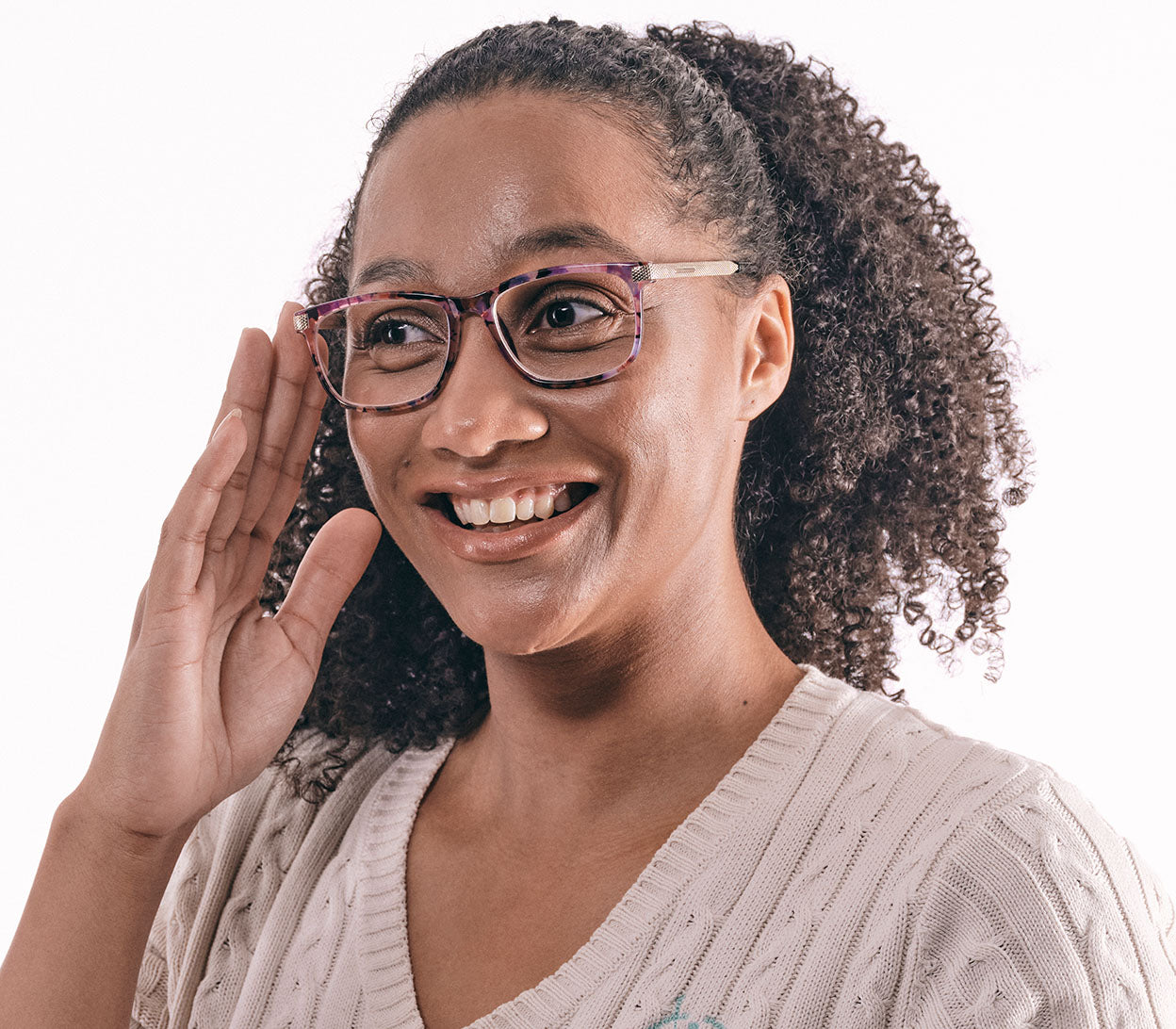 Female model wearing Lima (Multi-coloured) classic style, unisex reading glasses with oval lenses. Translucent, delicate floral patterned frames and gold arms.