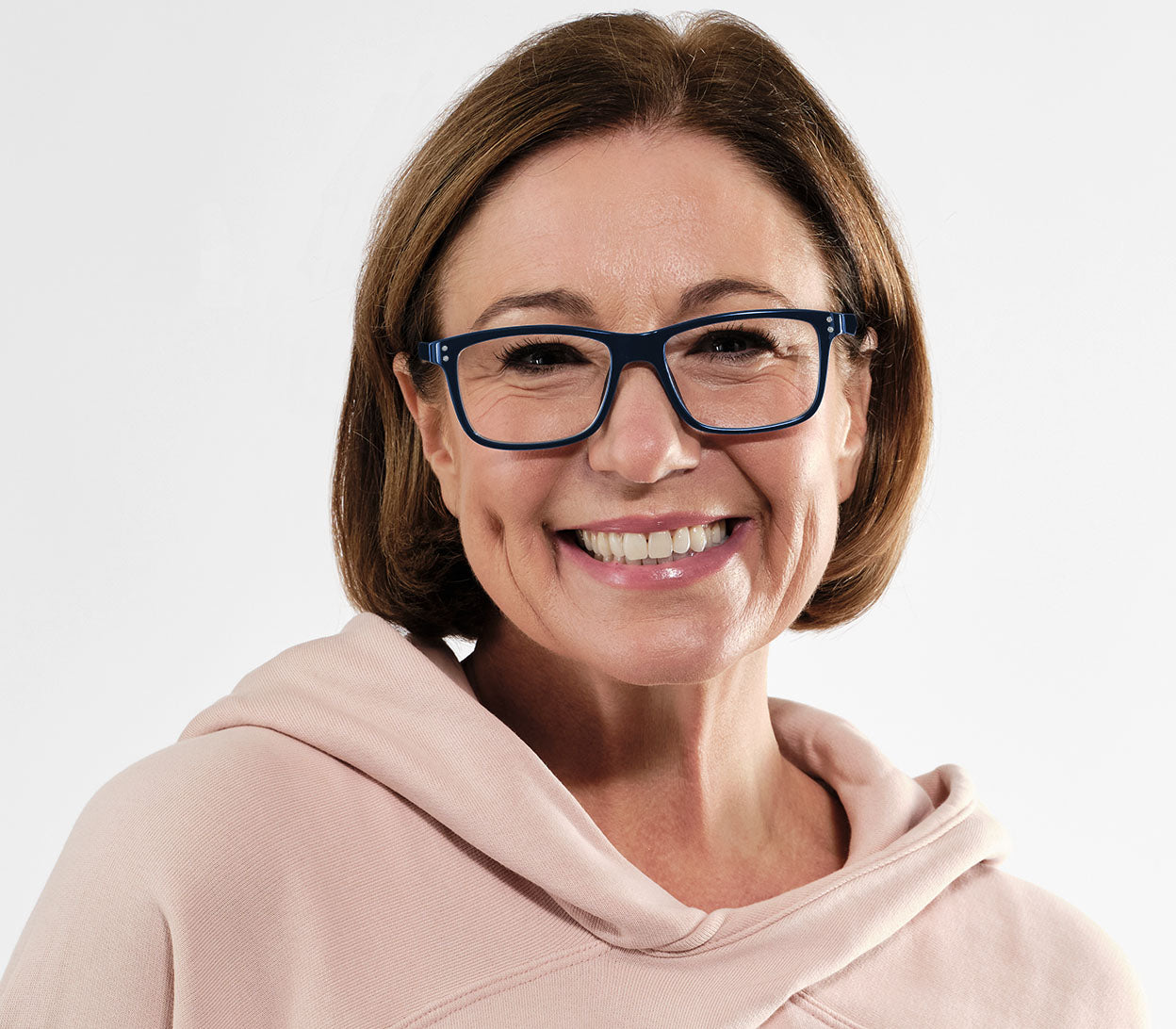 Female model wearing Dexter Bifocal (Blue) bifocal unisex reading glasses. Dark blue frames with a glossy finish.