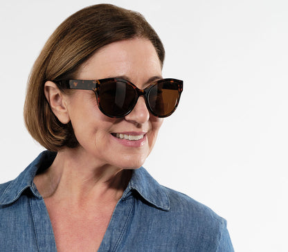 Female model wearing Amalfi (Tortoiseshell) bifocal reading sunglasses.