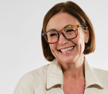 Female model wearing Toast (Multi-coloured) retro and fun reading glasses with large, oversized lenses and slender temples.