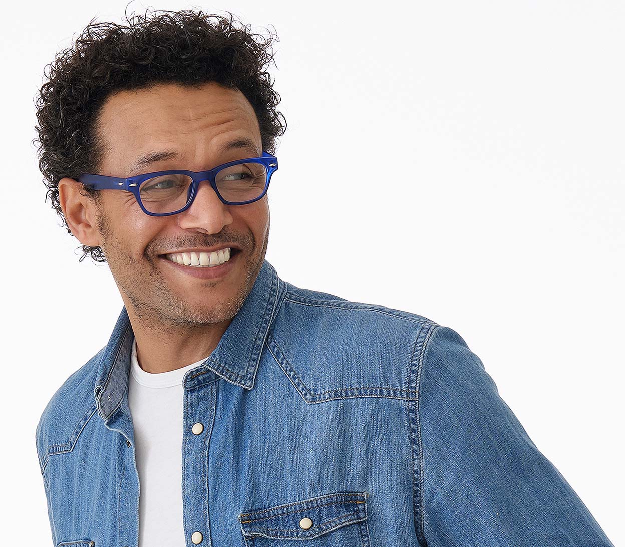 Male model wearing Woody (Blue) retro wayfarer style reading glasses with a bright blue frame and rivet details.