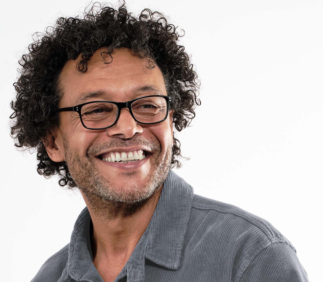 Male model wearing Eclipse (Black) classic shaped unisex reading glasses with oval lenses and a gloss black frame.