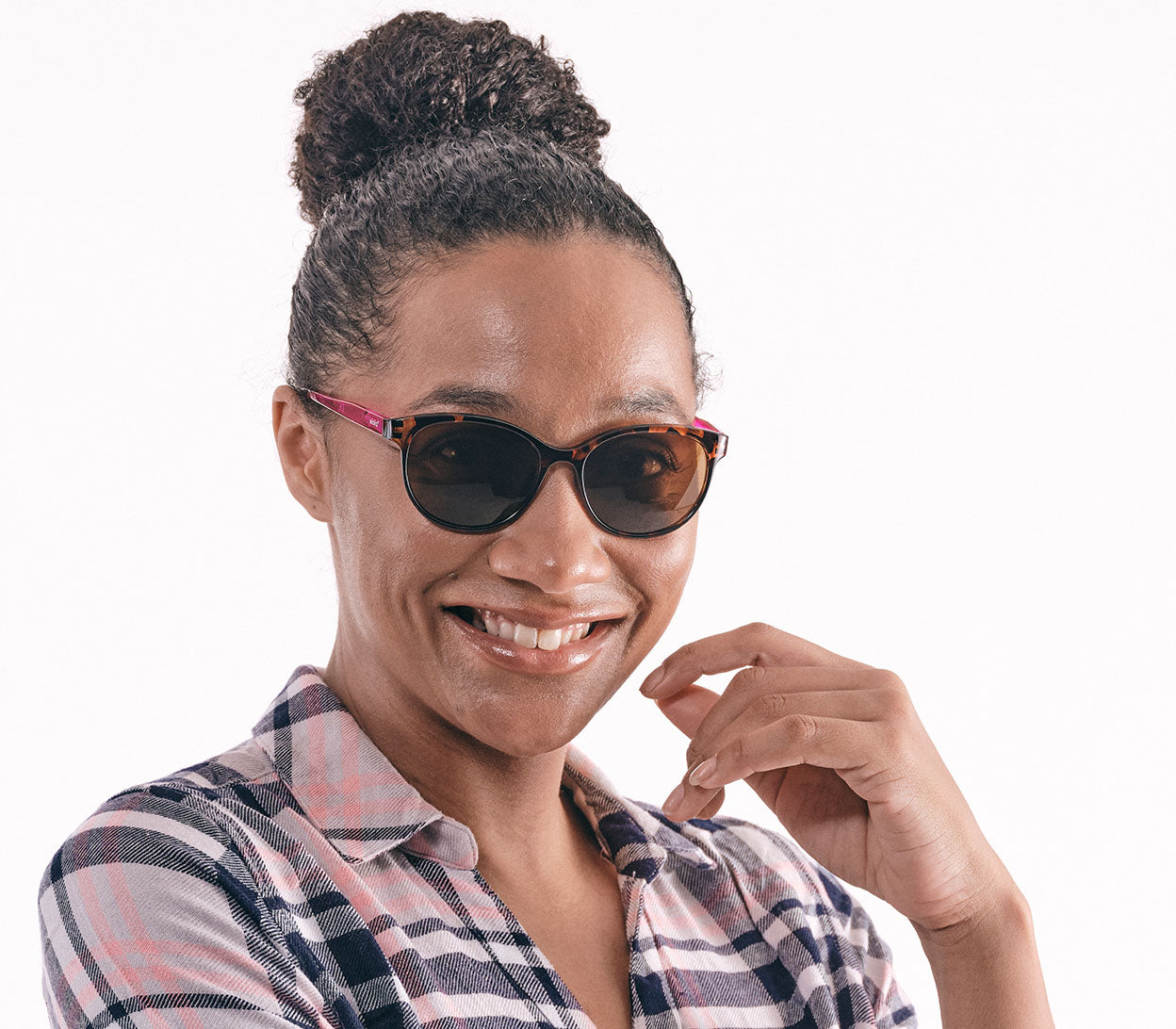 Sienna (Purple) cat eye shaped bifocal reading sunglasses with tortoiseshell frames and bright pink temples. Large oval lenses with a brown tint. Front view.