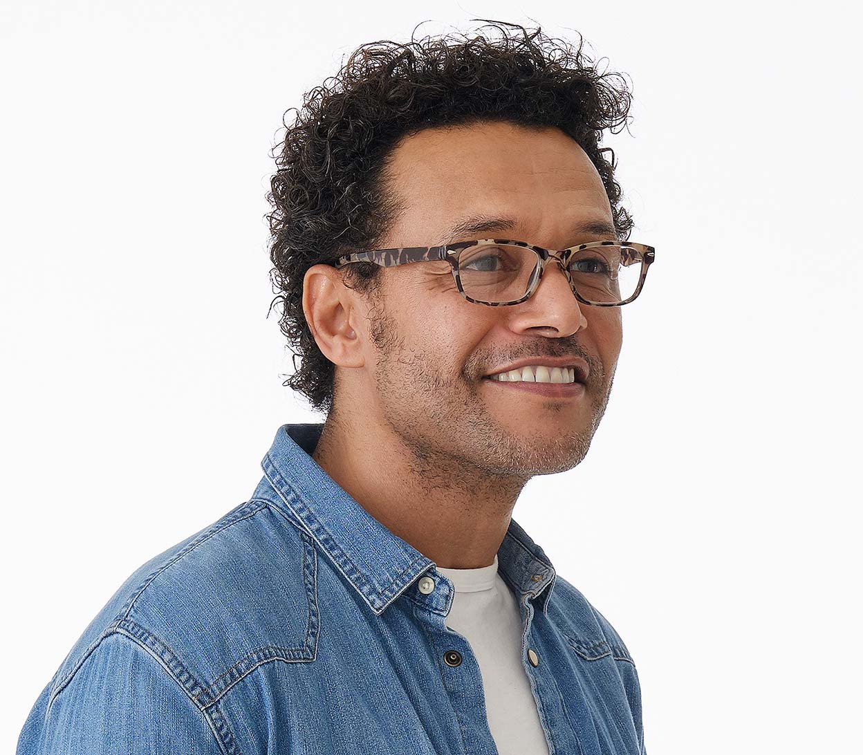 Male model wearing Zante (Tortoiseshell) classic shaped unisex reading glasses with a grey tortoiseshell pattern and rivet detailing.