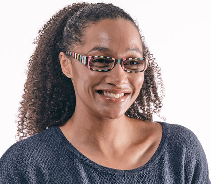 Female model wearing Shandy (Multi-coloured) classic women's reading glasses with striped multicoloured frames and a glossy finish.