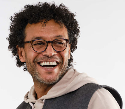 Male model wearing Marlow (Blue Tortoise) oval shaped reading glasses with a blue and brown tortoiseshell pattern and glossy finish.