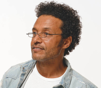 Male model wearing Cooper (Gunmetal) slimline rectangular, unisex reading glasses.