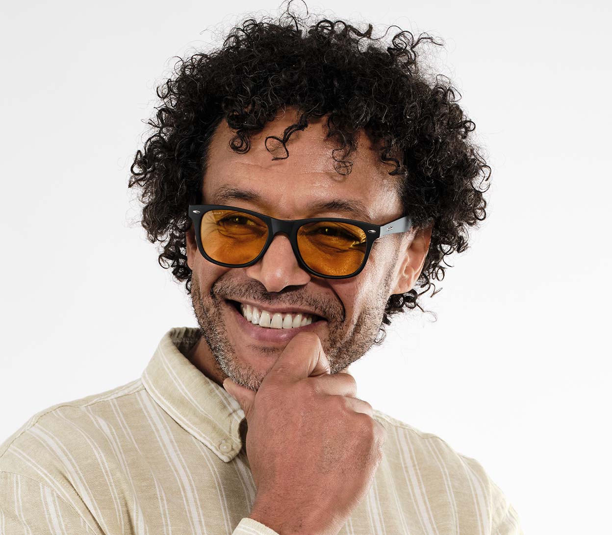 Male model wearing Grid (Black) classic wayfarer shaped night driving glasses.