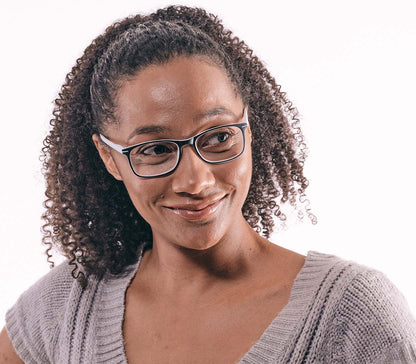 Female model wearing Jazz (White) classic shape reading glasses with rectangular lenses in a two tone black and white frame.