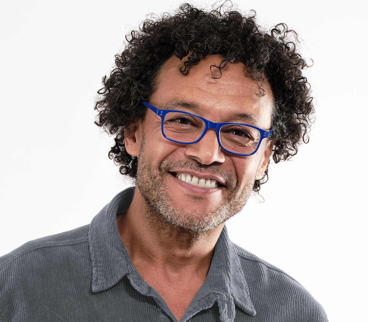 Male model wearing Eclipse (Blue) classic shaped unisex reading glasses with oval lenses and a gloss blue frame.