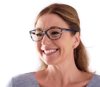 Female model wearing Courtney (Blue) women's cat eye shaped reading glasses with translucent blue frames.