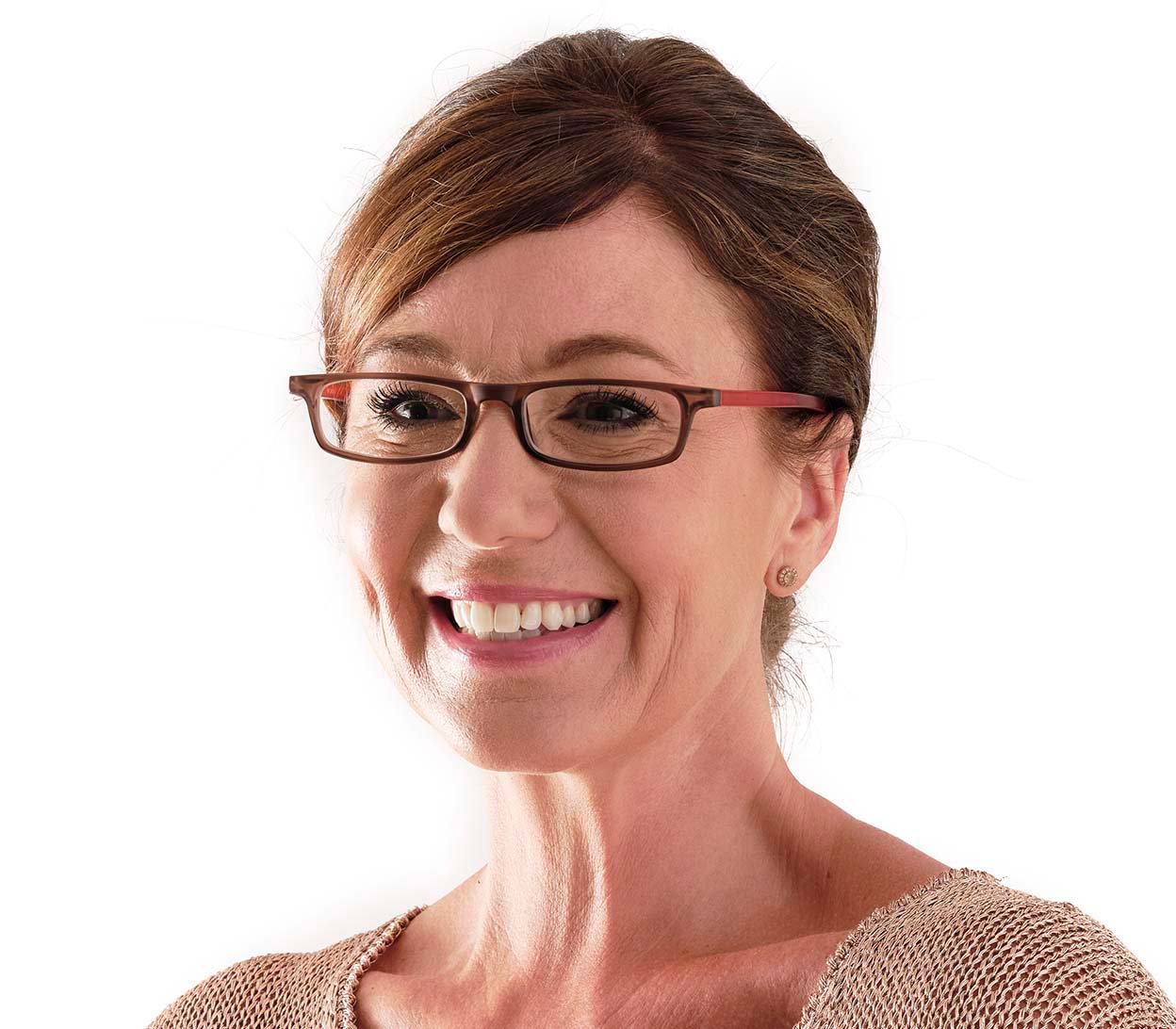 Female model wearing Jam (Orange) slender, rectangular unisex reading glasses with extra long arms to hang around your neck when not in use.