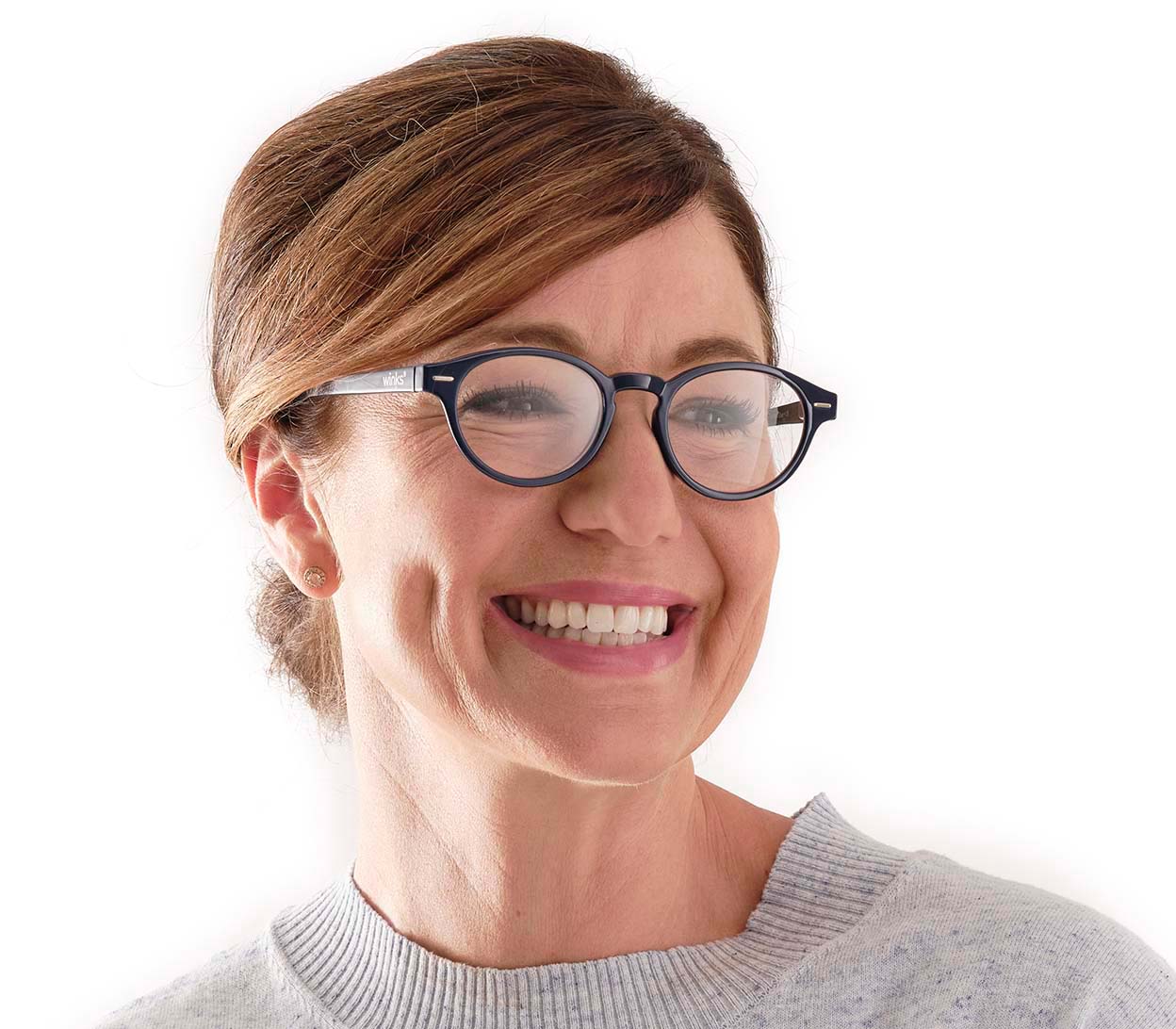 Female model wearing Espresso (Blue) unisex reading glasses with a dark blue frame and round, retro lenses.