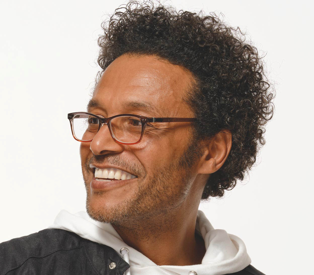 Male model wearing Penguin (Orange) classic vintage style, unisex reading glasses with a two tone orange and grey frame.