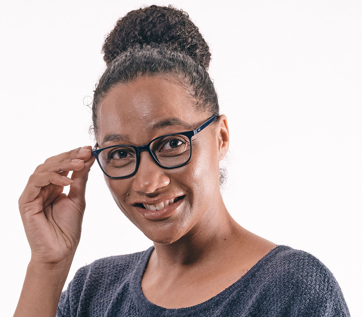 Female model wearing Artist (Blue) unisex reading glasses in a deep blue finish with oval lenses.