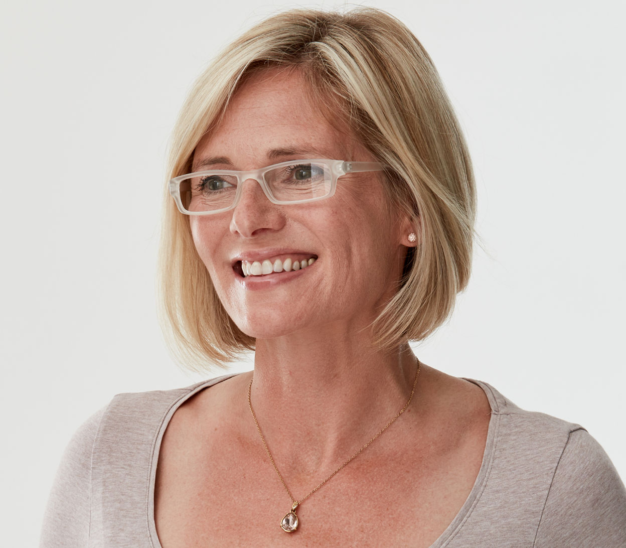 Female model wearing Action (Clear) unisex reading glasses. Classic shaped glasses with a smooth matt finish.