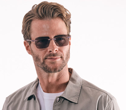 Jelli Sun (Multi Tortoise) unisex sun reading glasses with large square lenses and multicoloured, tortoiseshell arms and details. Side view.