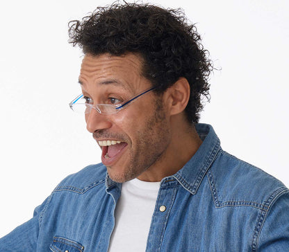 Male model wearing Soda (Blue) seek, compact and ultra lightweight reading glasses with clear frames and blue detailed temples.
