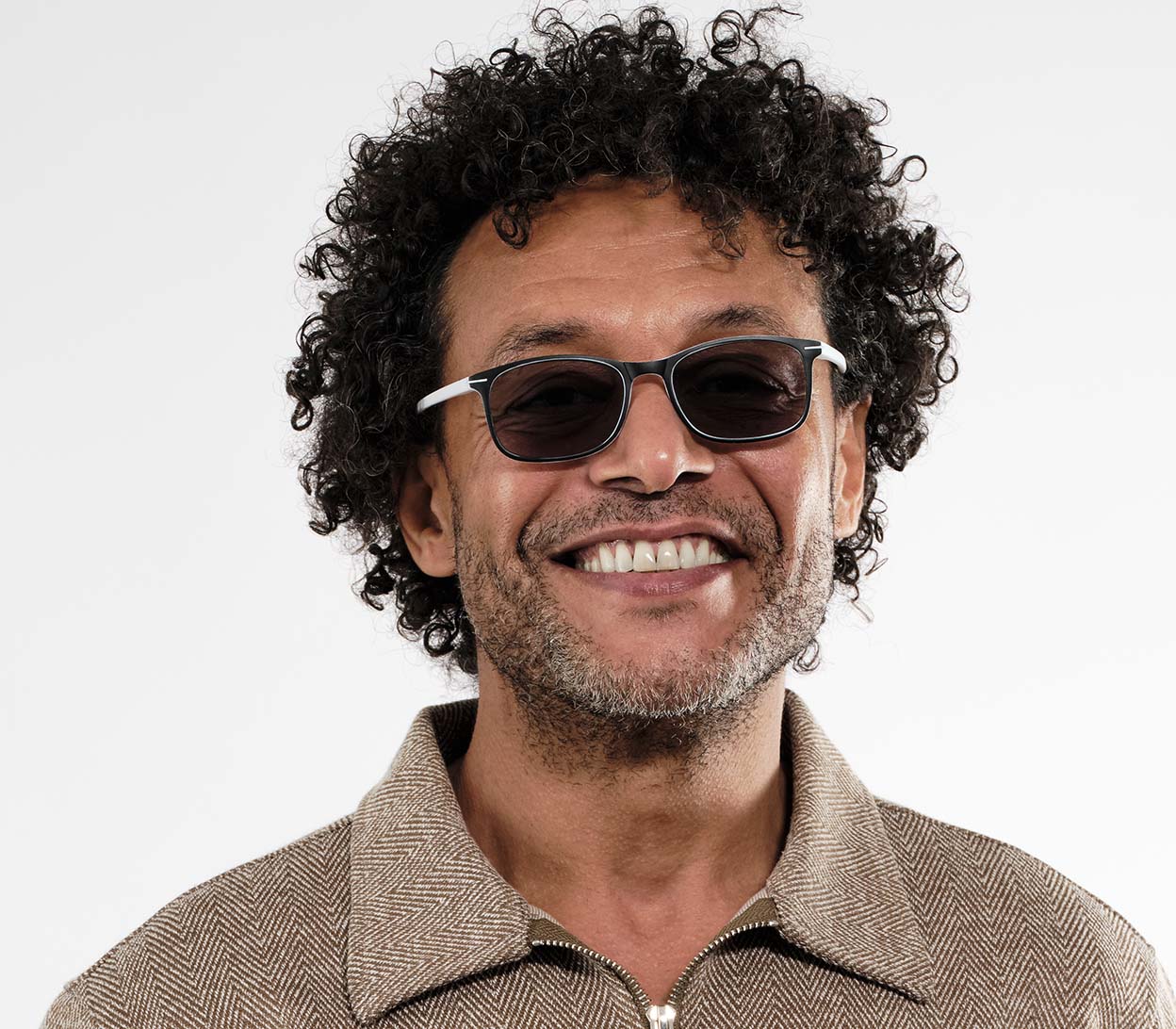 Male model wearing Esprit (White) sunglasses with two tone white and black frames and temples. Classic shaped lenses with a smoke grey tint.