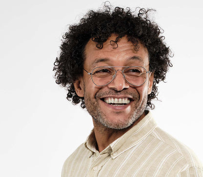 Male model wearing Mateo (Silver) classic aviator shaped reading glasses with a slim silver frame and oversized lenses.