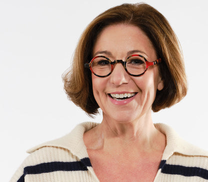 Female model wearing Snowball (Red Tortoise) vintage style unisex reading glasses with round lenses and luxury red tortoiseshell frame.