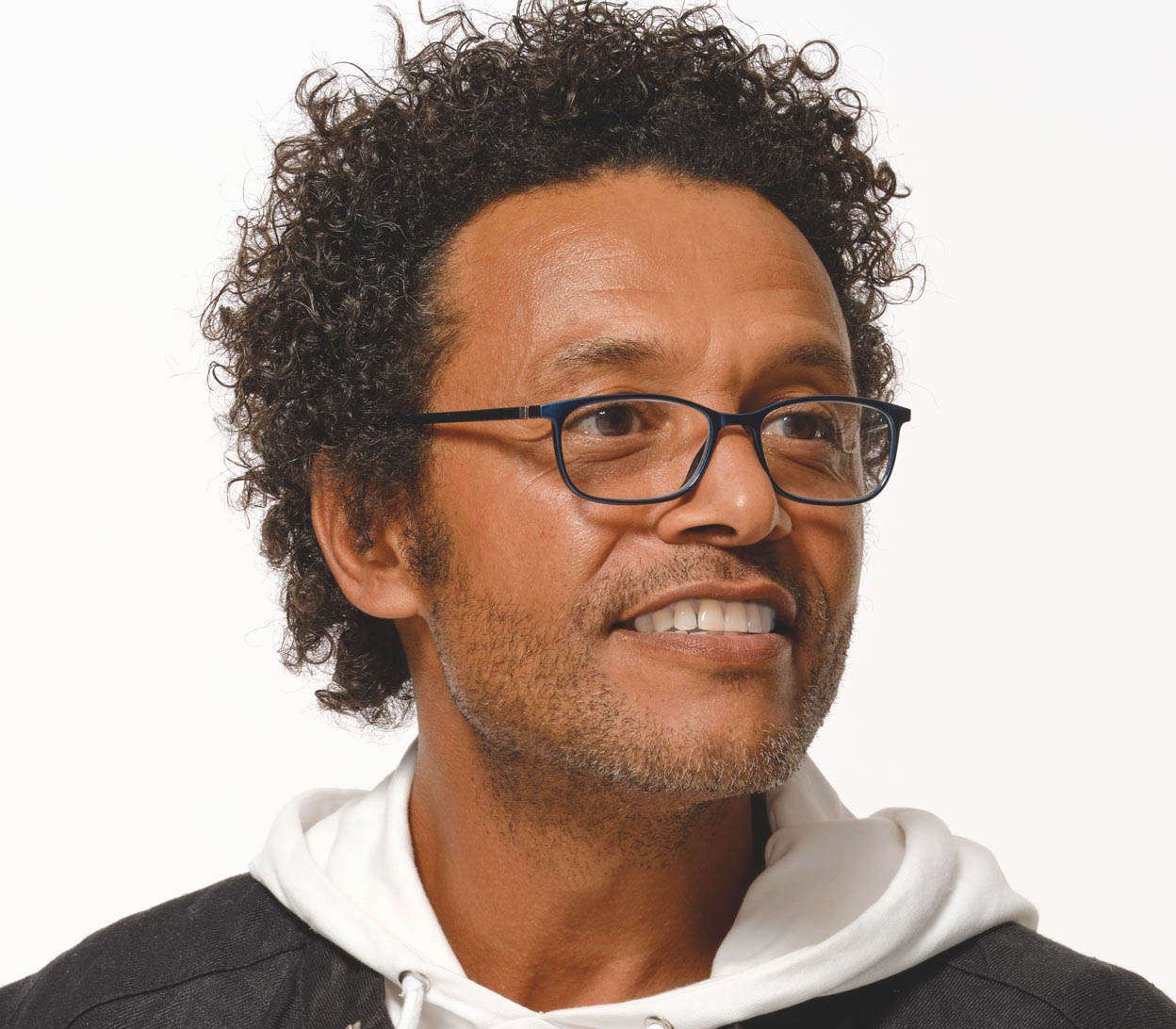 Male model wearing Martini (Blue) classic shaped slender unisex reading glasses with a deep blue frame in a glossy finish.