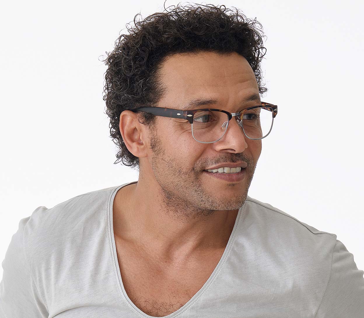 Male model wearing Harvard (Tortoiseshell) classic unisex clubmaster reading glasses with metal frame details and matt tortoiseshell temples.
