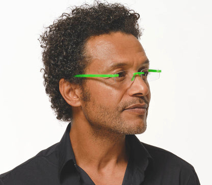 Male model wearing Jelli Neon (Green) rimless, slim reading glasses with semi-translucent bright green arms and bridge.