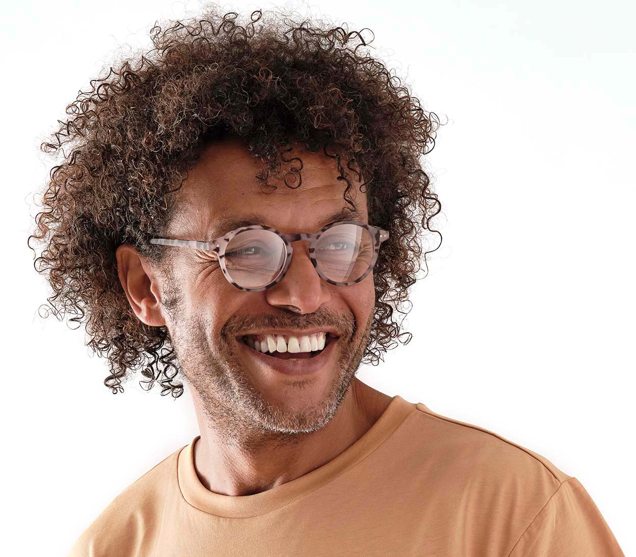 Male model wearing Oskar (Grey Tortoise) unisex reading glasses with large round lenses and grey tortoiseshell frames.