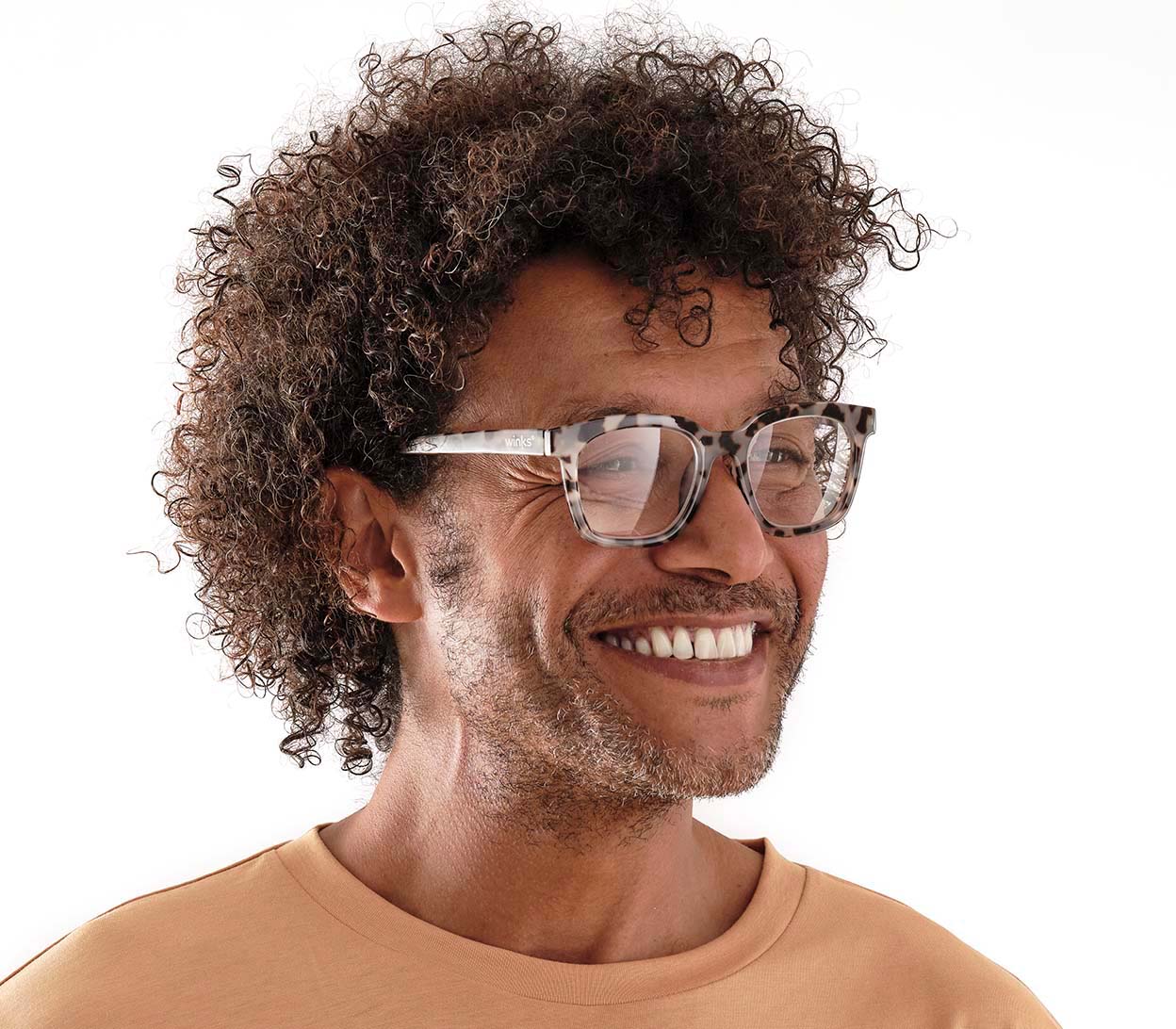 Male model wearing Toast (Grey Tortoise) retro grey tortoiseshell reading glasses with large, oversized lenses and slender temples.
