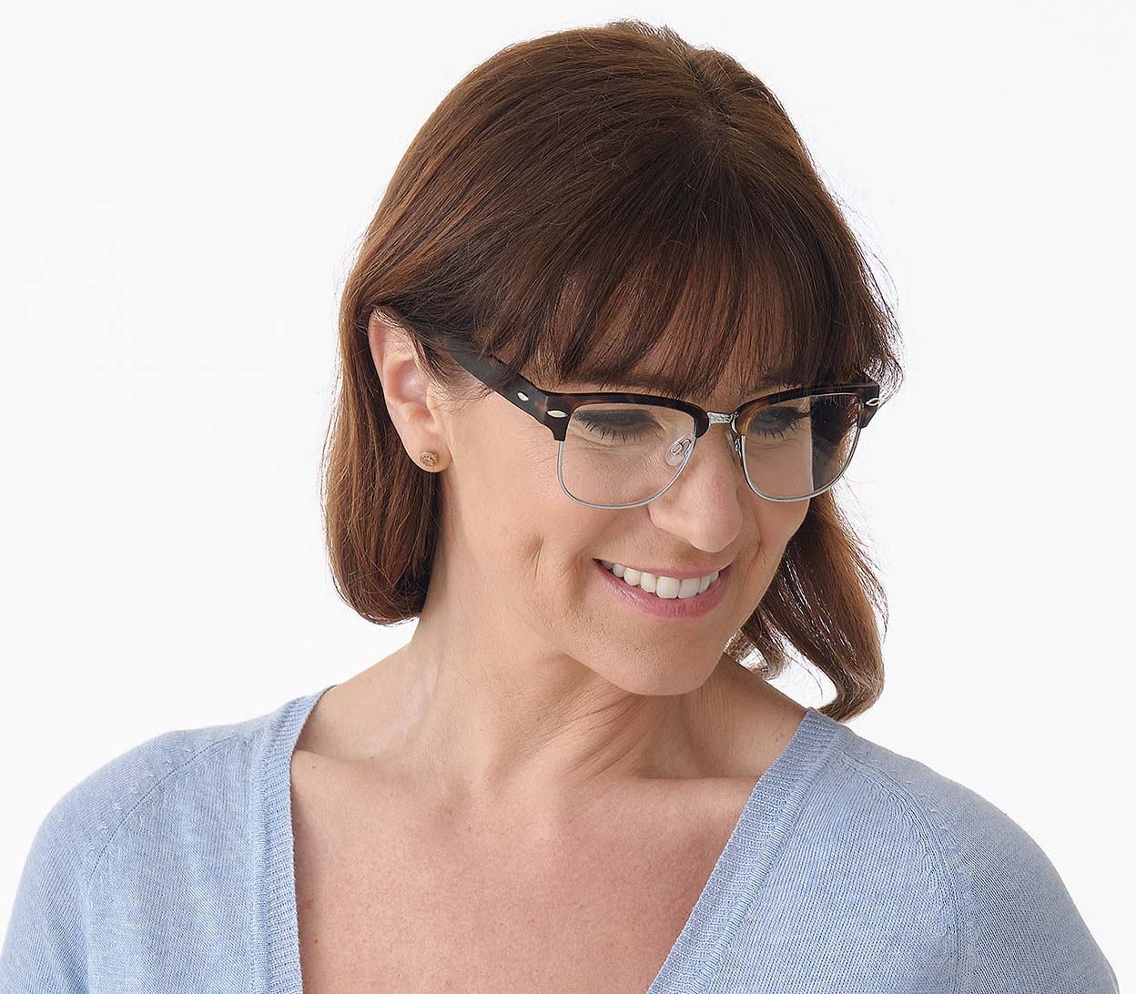 Female model wearing Harvard (Tortoiseshell) classic unisex clubmaster reading glasses with metal frame details and matt tortoiseshell temples.