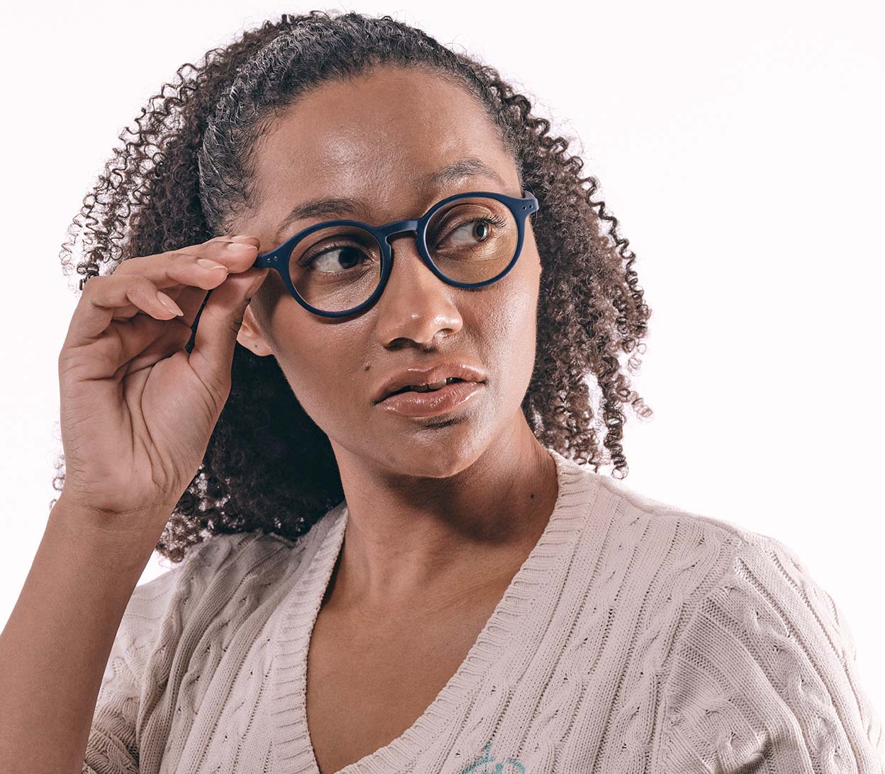 Female model wearing Oskar Digital (Blue) unisex reading glasses with large round blue light filtering lenses and soft touch deep blue frame.