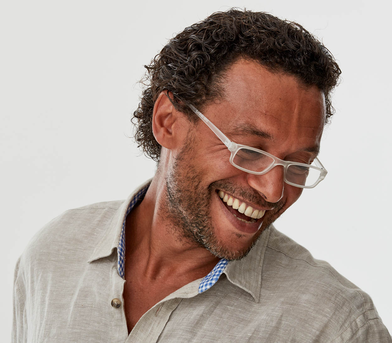 Male model wearing Action (Clear) unisex reading glasses. Classic shaped glasses with a smooth matt finish.