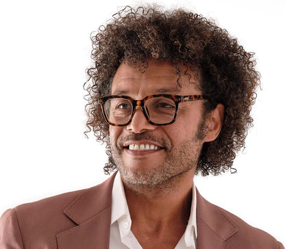 Male model wearing Toast (Tortoiseshell) retro and classic reading glasses with large, oversized lenses and slender temples.