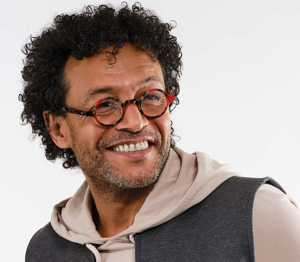 Male model wearing Snowball (Red Tortoise) vintage style unisex reading glasses with round lenses and luxury red tortoiseshell frame.