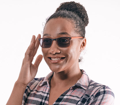 Female model wearing Esprit (Orange) sunglasses with two tone orange and black frames and temples. Classic shaped lenses with a smoke grey tint.