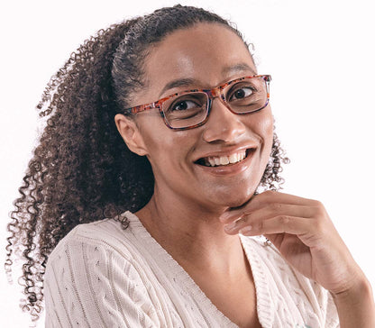 Female model wearing Dexter (Multi-coloured) classic shape unisex reading glasses with a translucent, glossy multicoloured frame.