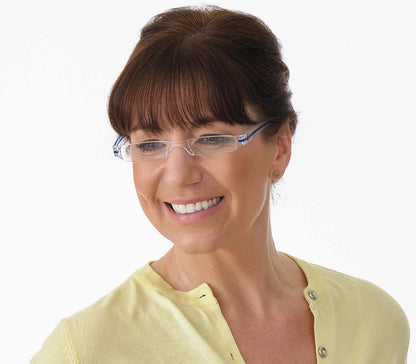 Female model wearing Soda (Blue) sleek, compact and ultra lightweight reading glasses with clear frames and blue detailed temples.